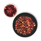 Vernal Muse loose leaf fruit tea with brewed infusion and dried berry blend displayed in bowls on dark background