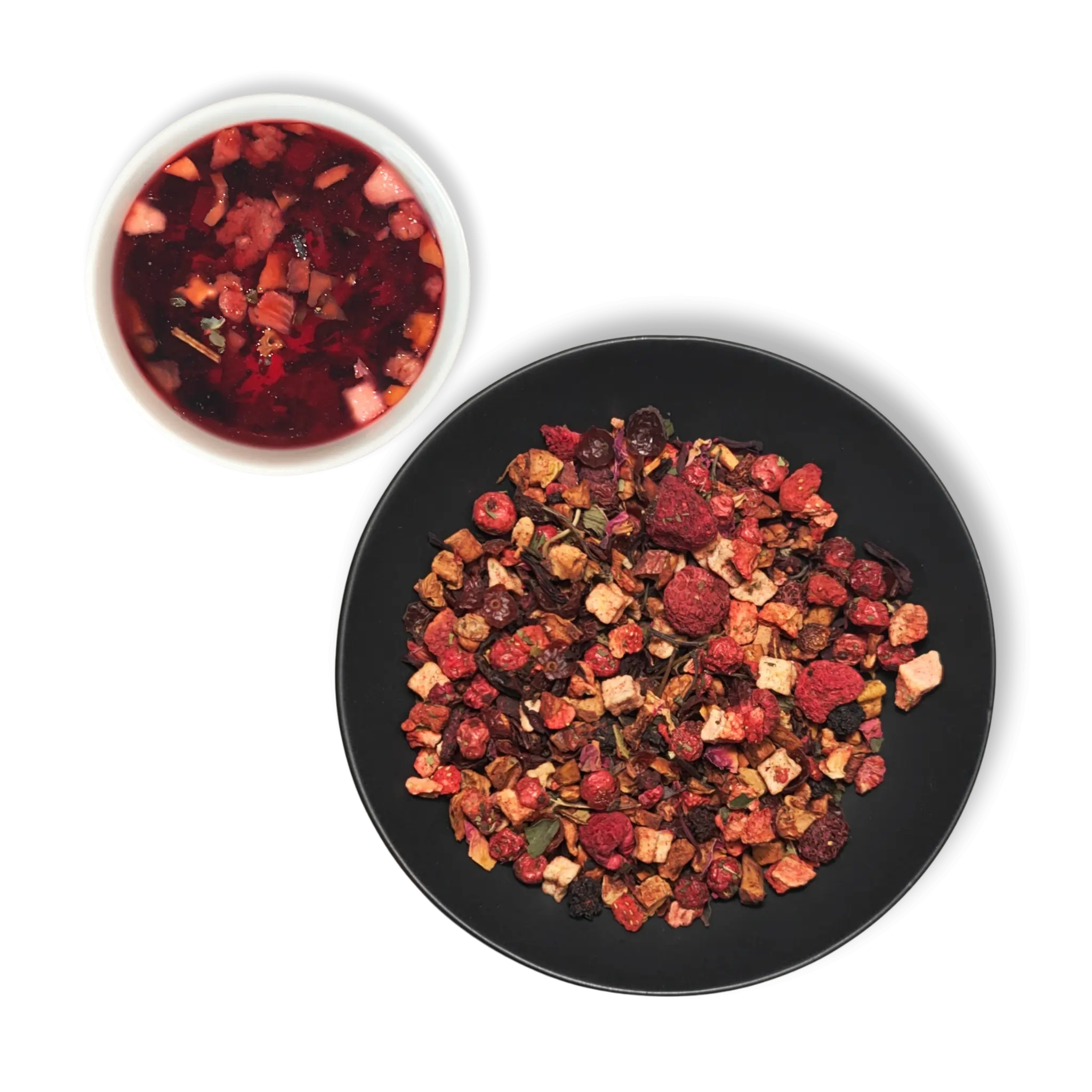 Vernal Muse loose leaf fruit tea with brewed infusion and dried berry blend displayed in bowls on dark background