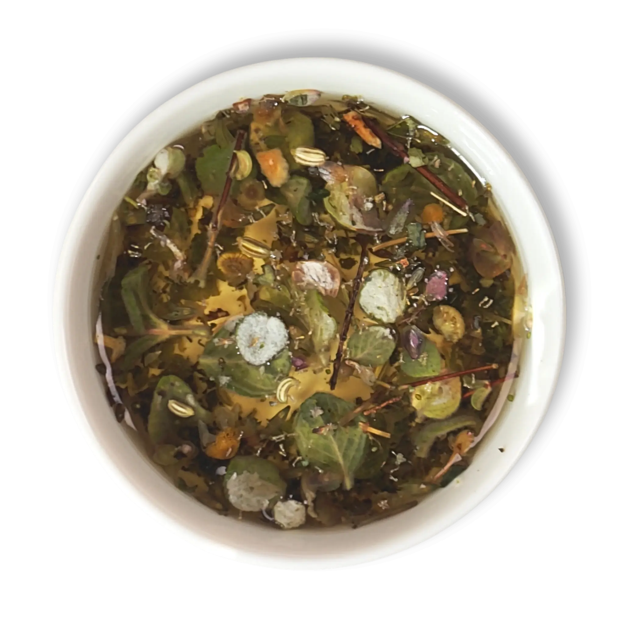 Top view of brewed Aether of Crete herbal tea showing whole Mediterranean herbs, citrus peel and dittany leaves in golden infusion.