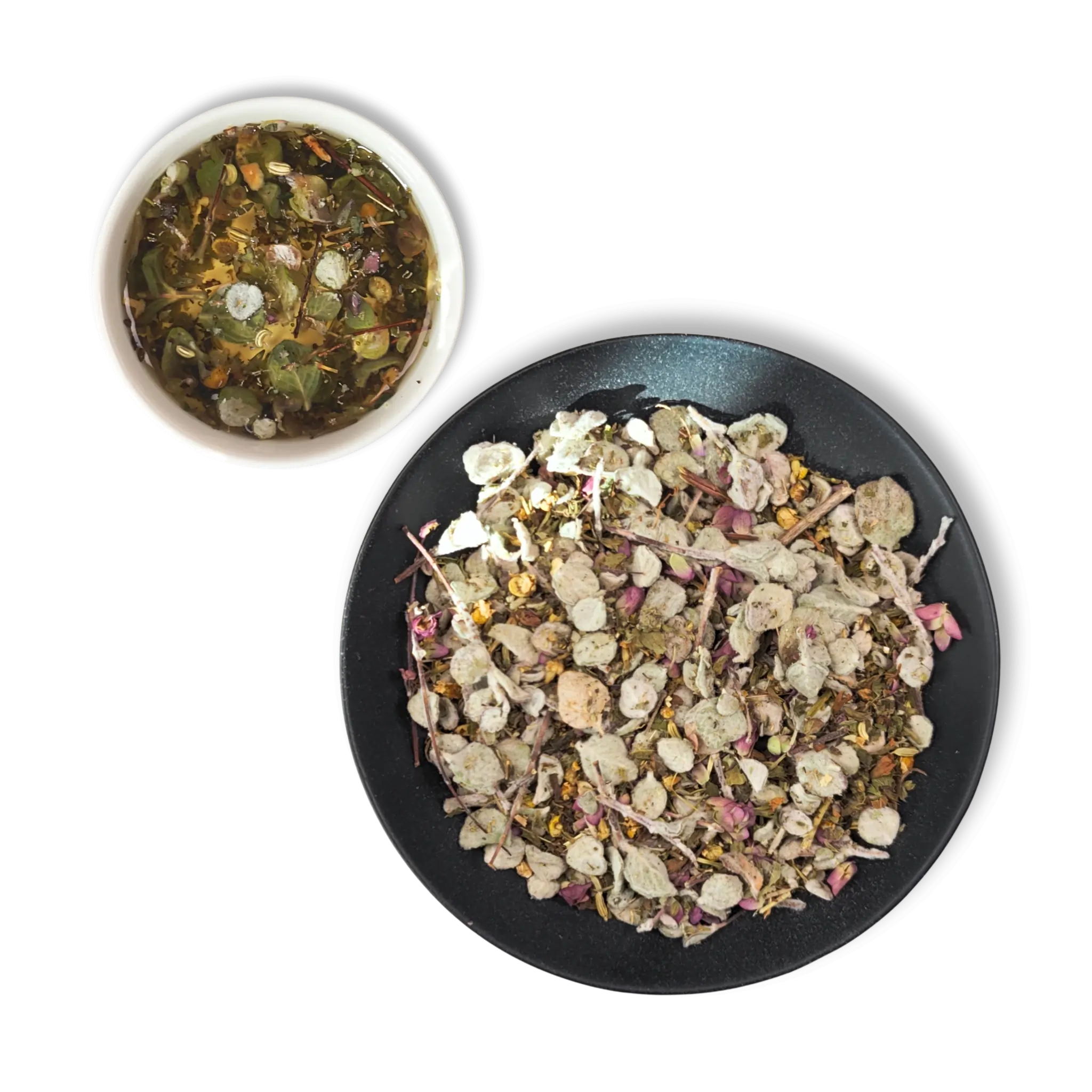 Loose leaf Aether of Crete organic herbal tea blend with Cretan dittany, chamomile, sage and citrus peel next to freshly brewed cup.