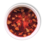 Crimson Orchard berry fruit tea infusion in a white cup showing bright red hibiscus and cranberry brew with apple pieces