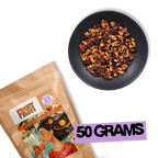 Crimson Orchard loose-leaf fruit tea blend with apple and hibiscus next to 50g Holy Tea package