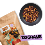 Crimson Orchard loose-leaf fruit tea blend with apple and hibiscus next to 100g Holy Tea package