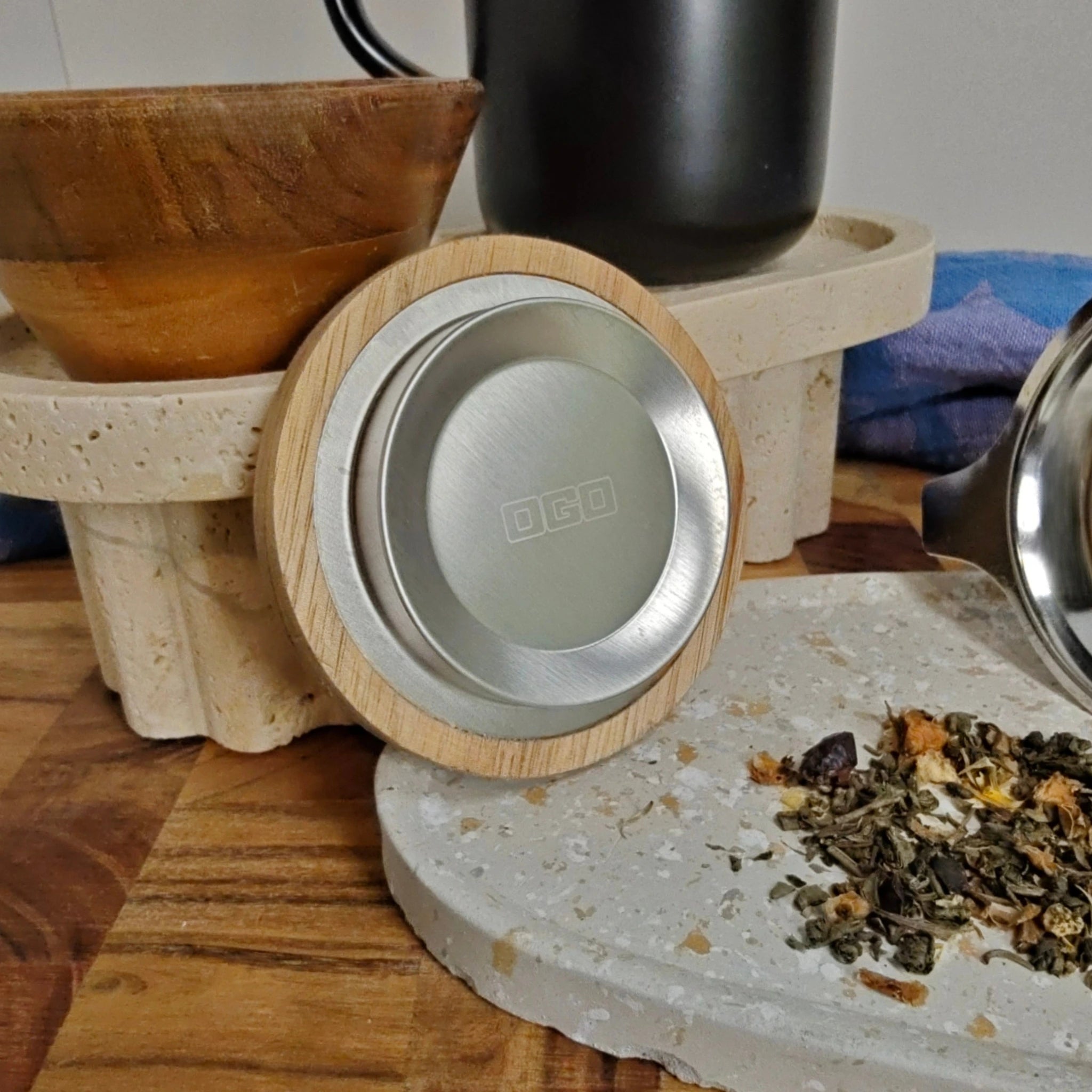 Close-up of acacia wood lid with stainless steel insert for the Juliet tea mug.