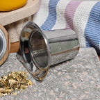 Detail of fine mesh stainless steel infuser for loose-leaf tea for the Juliet mug.