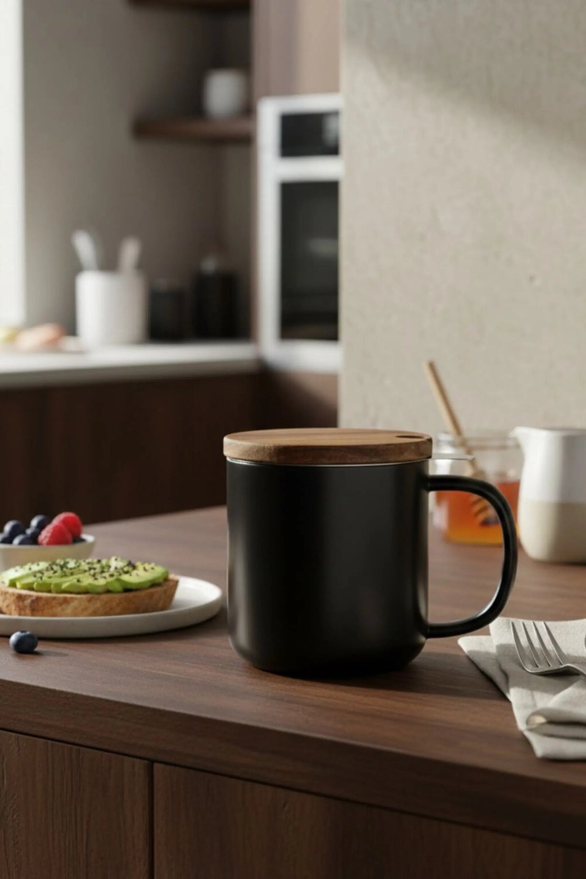 Juliet Black 300 ml tea mug with acacia lid on a table with loose-leaf tea